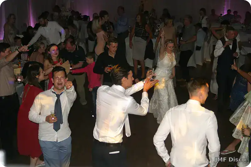 Bride and guests enjoying the dance floor at a small wedding reception in Kent
